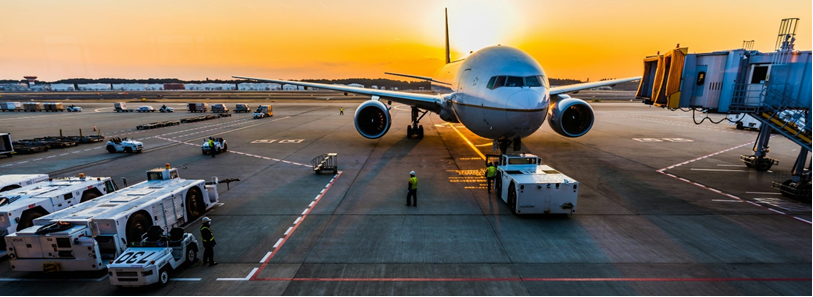 gray airplane on parking